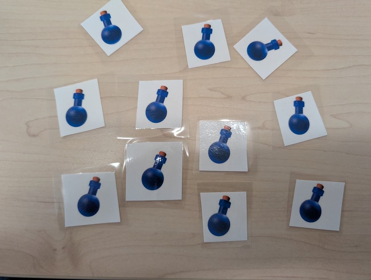 Laminated potion cards used as physical rewards